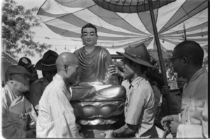 Vietnamese airforce soldiers attending Buddhist ceremony with head monk Tam Chau.