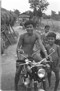 Affluent farmer riding a new motorbike; Gia Dinh Province.