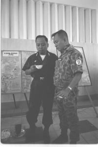 General Khanh having coffee with General Do Cao Tri and U.S. military advisors.