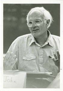 John C. Cox at desk