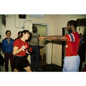 Man preparing to box in front of audience