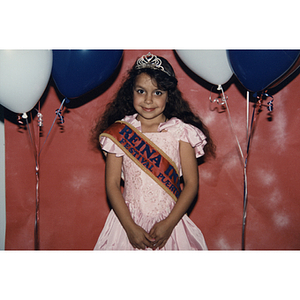 A young girl wears a crown and sash at the Festival Puertorriqueño