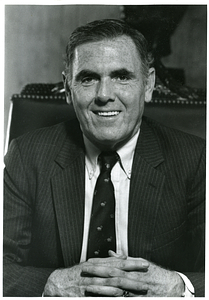 Portrait of Mayor Raymond L. Flynn sitting in chair