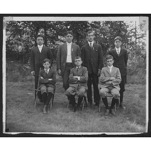 Group of youth pose for photo outdoors at Camp School, Allston