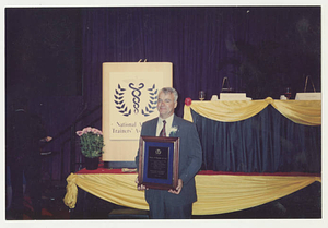 Charlie Redmond with NATA Distinguished Athletic Trainer award (1994)