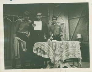 Actors reading lines on stage during a rehearsal of "Three Angels" at Suffolk University's C. Walsh Theatre (55 Temple Street)