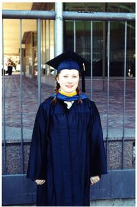 A graduate student in her cap and gown at the 2002 Suffolk University commencement