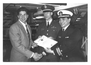 A Suffolk University Law School student receives a Navy Award
