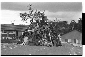 Children climb pile of wood before 12th of July bonfire