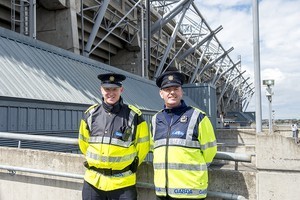 Two Garda (police) at the back of the Hogan Stand, at the 2012 50th Eucharistic Congress, Final Day Ceremony, 17th June, at Croke Park GAA Stadium, Dublin