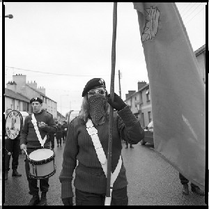 Sinn Fein protest march at Toomebridge, Co. Antrim. Name of new bridge contested, proposed to be "Roddy McCorley bridge" after the famous Irish rebel. Photographs include the marchers, Republican bands, and well known IRA activist Martin Meehan