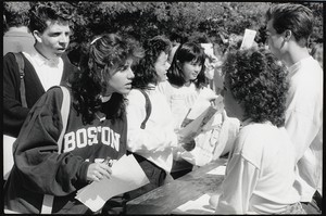 Students in conversation during outdoor event at Boston College