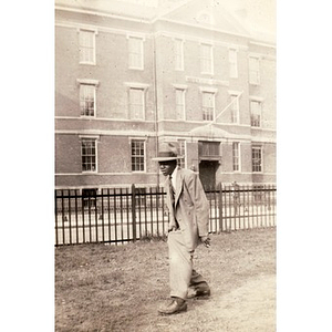Unidentified boy poses in front of the Sherwin School on Sterling Street