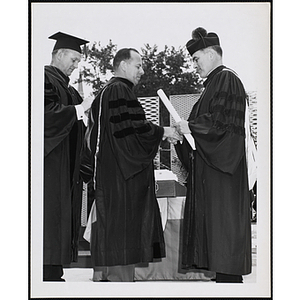 Paul F. Hellmuth, president of the Boys' Clubs of Boston, receives an honorary degree at the University of Notre Dame Commencement