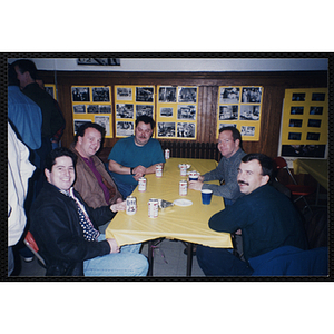Five men sit at a table during a Bunker Hillbilly reunion event