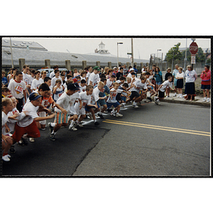 Children take off from a start line at the Battle of Bunker Hill Road Race