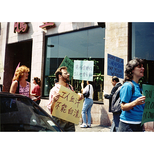 Demonstrators protesting to get back wages for workers at Dynasty Restaurant