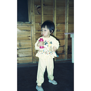 Young girl playing with bubbles