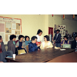 Audience donating money at a meeting between Mexican workers and the Chinese Progressive Association