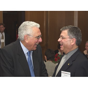 John Hatsopoulos, left, and George ?, right, laughing together while at gala dinner in Hatsopoulos' honor