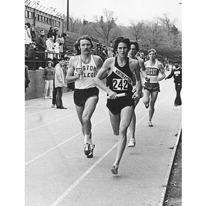 Sprinter Ralph Bowman, #242, winning a relay race