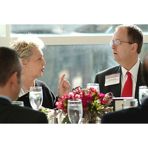 Mary Margaret Baker, '72, left, and Bill Bartolini, Vice President of Development, speak at the NU Today Cancer Research Panel luncheon