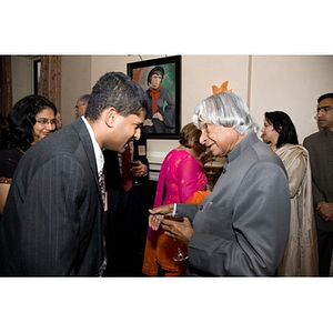Dr. A. P. J. Abdul Kalam speaking with a guest at a party