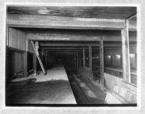 Washington Station east bound platform, showing a worker on a ladder