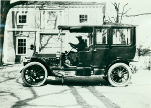 Automobile parked in front of Codman House carriage house, Lincoln, Mass.