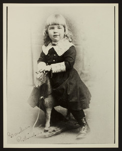 Full-length portrait of Gardner Richardson, sitting on a toy horse, facing front, Dartmouth Photographic Studio, Hanover, New Hampshire