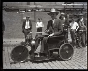 David T. Dickinson in motorized wheelchair