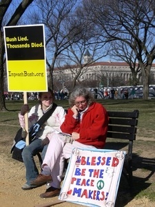 Protesters seated on a bench on the National Mall, marching against the War in Iraq