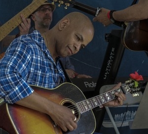 Guy Davis playing guitar during the Clearwater Folk Festival