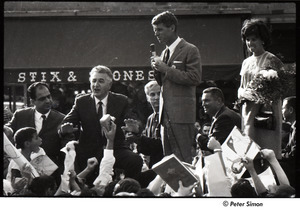 Robert Kennedy and Kenneth Keating campaigning in Riverdale: Robert Kennedy holding a microphone