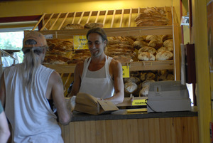 Hungry Ghost Bread: owner and baker Jonathan C. Stevens serving customers at the counter