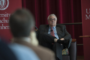 Congressman Barney Frank seated on the Student Union Ballroom stage, UMass Amherst, during his book event