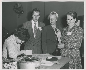 Attendees at the TB Convention observe a woman at work
