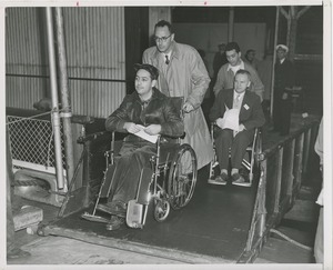 Wheelchair users assisted across gangplank