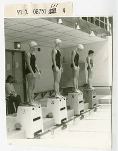 Women swimmers on starting blocks in Linkletter Natatorium