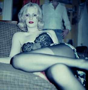 Candy Darling seated at party