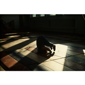 Person doing stretches in a gym