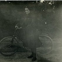 Woman next to a bicycle