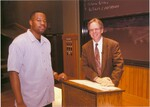 Suffolk University Professor Robert J. Allison (CAS) and student in a classroom, photograph, circa 1990s