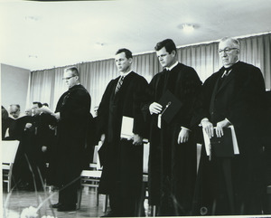 President John W. Lederle, Governor Endicott Peabody, Senator Edward Kennedy, and James T. Nicholson standing at Charter Day convocation