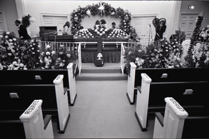 Duane Allman's funeral: musicians setting up with Duane Allman's casket in foreground, from left: Jaimoe, Barry Oakley, Delaney Bramlett, Dickey Betts, Butch Trucks, and Thom Doucette