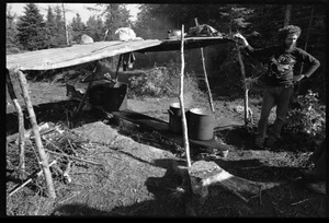 Man standing by a makeshift shelter, Earth People's Park