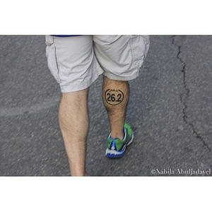 Man with "26.2" marathon tattoo at the 2013 Boston Marathon