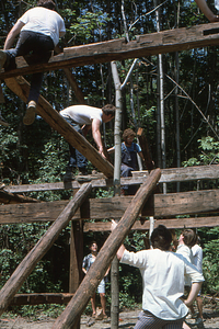 Adjusting rafters at the Moon Barn Raising at entrance to Hopkins Forest on 2 August 1975.
