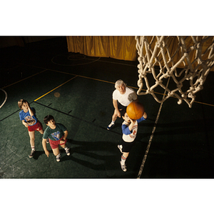 Boys practicing basketball skills