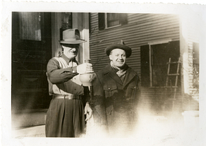 Manny Dias with friend holding jug